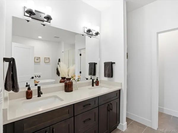 a bathroom with a tub and a sink