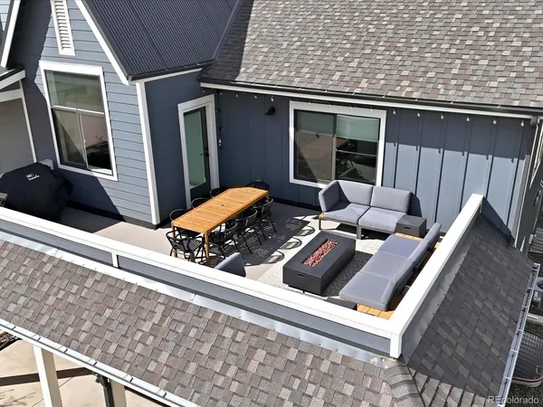 a view of house with a swimming pool outdoor seating