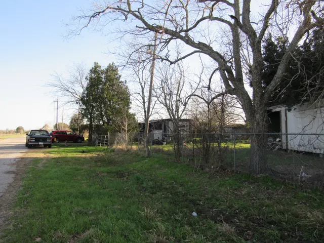 a backyard of a house with lots of green space