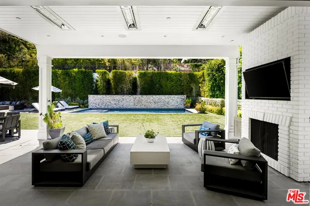 a view of swimming pool with seating area