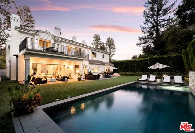 a view of a lake with a house in the background
