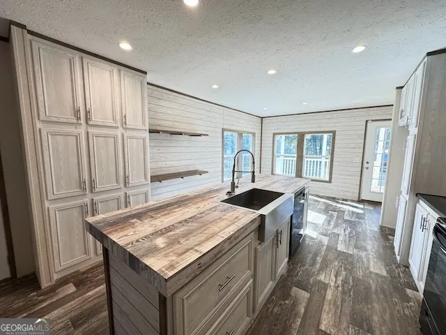 a kitchen with stainless steel appliances granite countertop a stove and a refrigerator