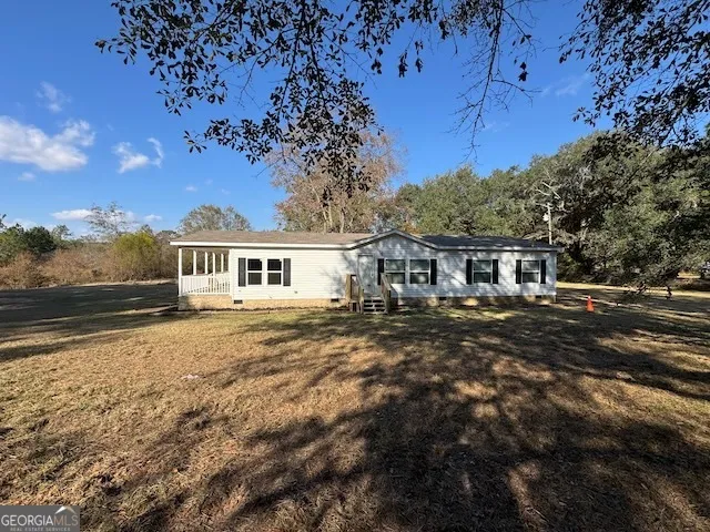 a view of outdoor space with deck and yard