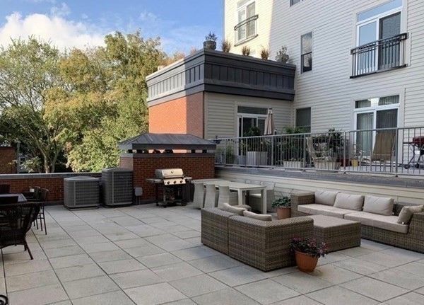 a view of a couches and a tables in the patio