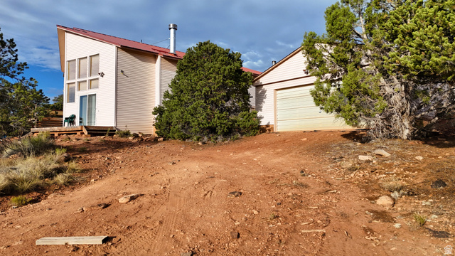 358 South Sky Drive Torrey, UT 84775 - Photo 10 of 82 Contemporary-style residence featuring a red metal roof and light-colored siding