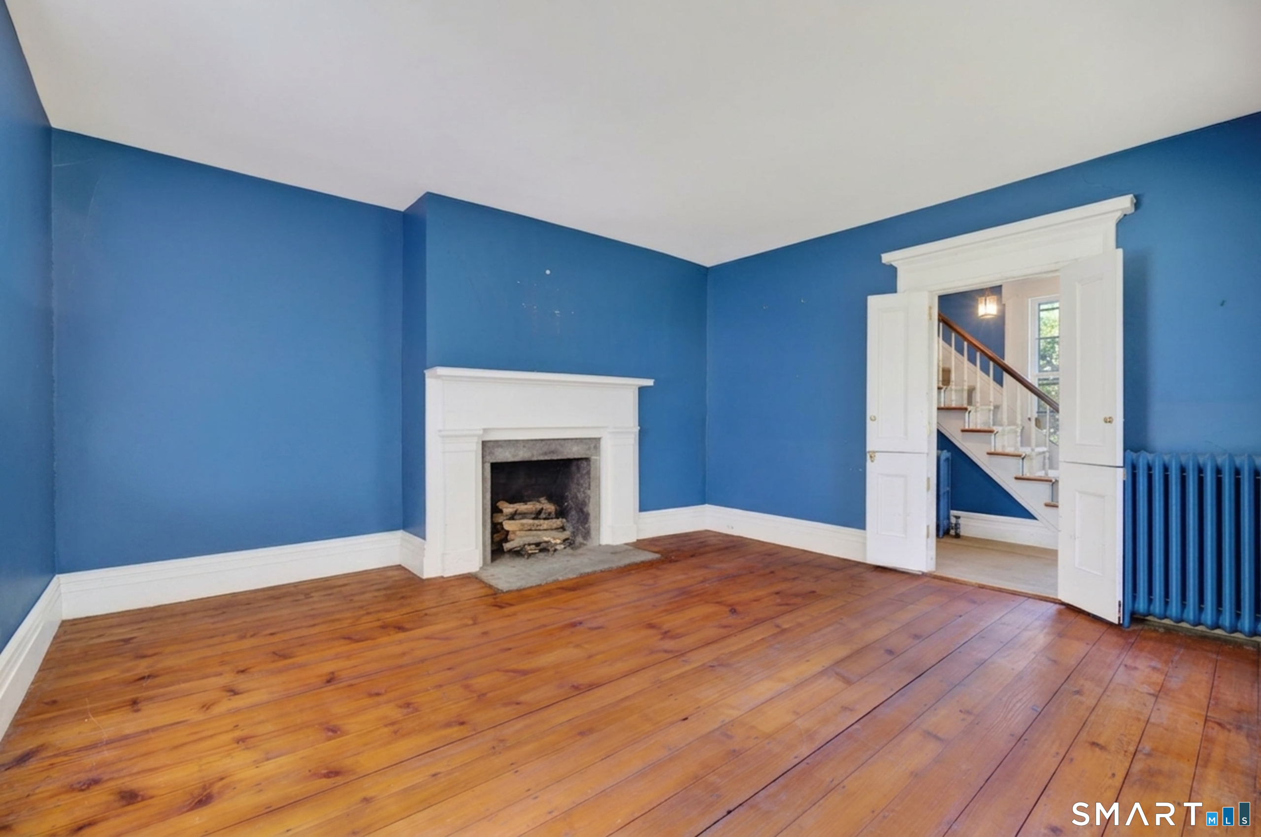 2 Rowland Road Old Lyme, CT 06371 - Photo 22 of 40 The front living room or "Parlor" is stately and would be a perfect place to retire in front of the fire.