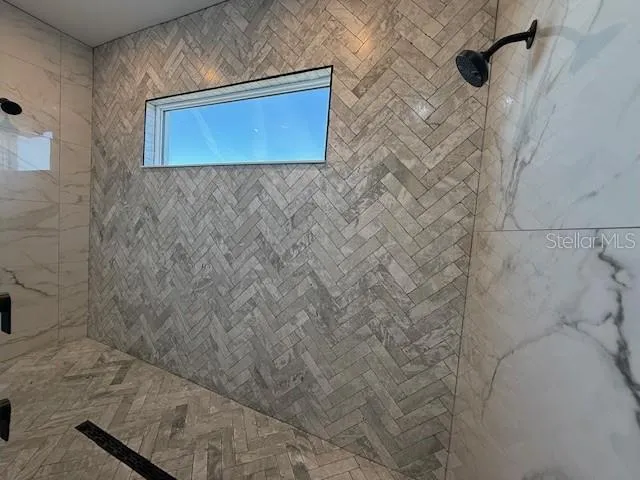 a bathroom with a sink and a shower