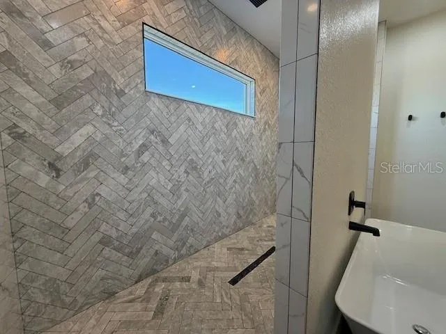 a bathroom with a sink and a mirror
