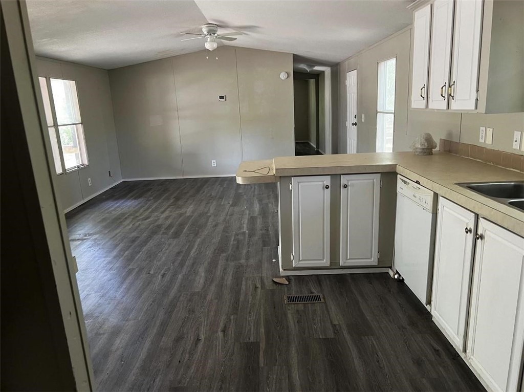 229 North 2nd Street Walnut Springs, TX 76690 - Photo 2 of 6 wooden floor in an empty room with a window