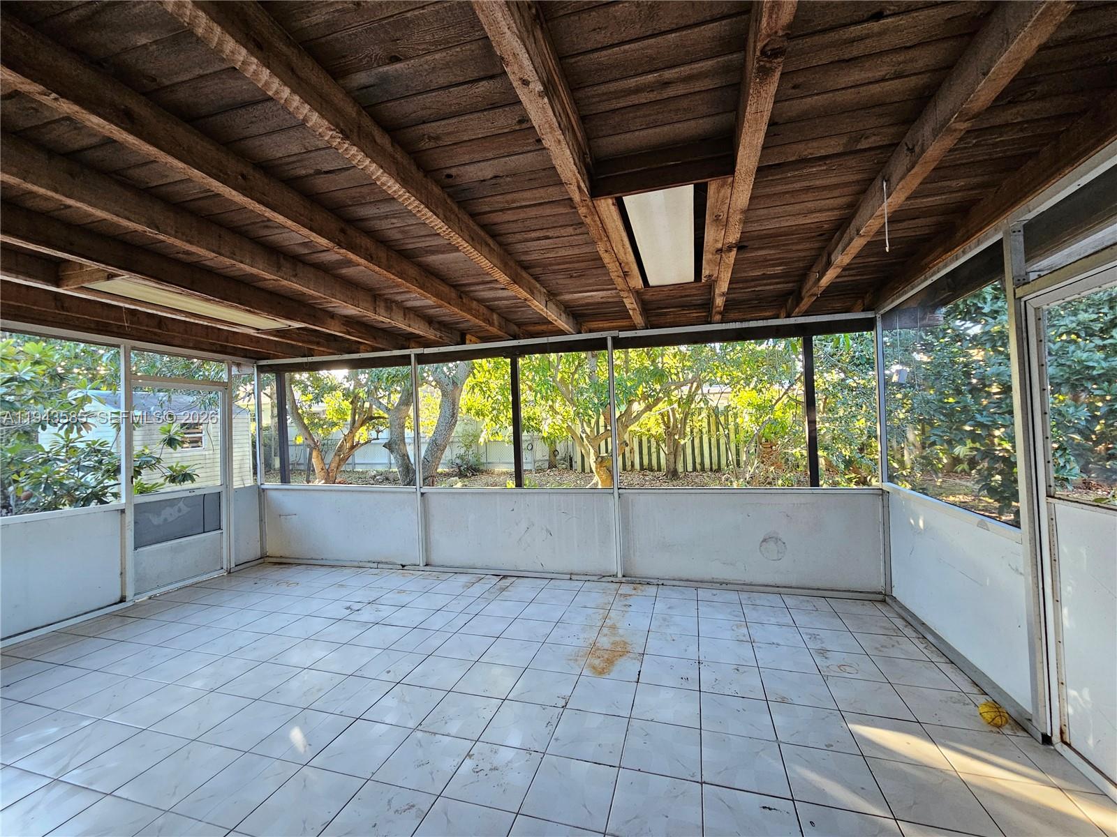 9940 Southwest 162nd Street Miami, FL 33157 - Photo 16 of 21 a view of empty room with wooden floor and fan