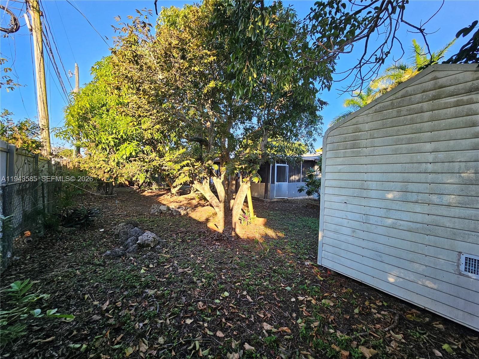 9940 Southwest 162nd Street Miami, FL 33157 - Photo 19 of 21 a backyard of a house
