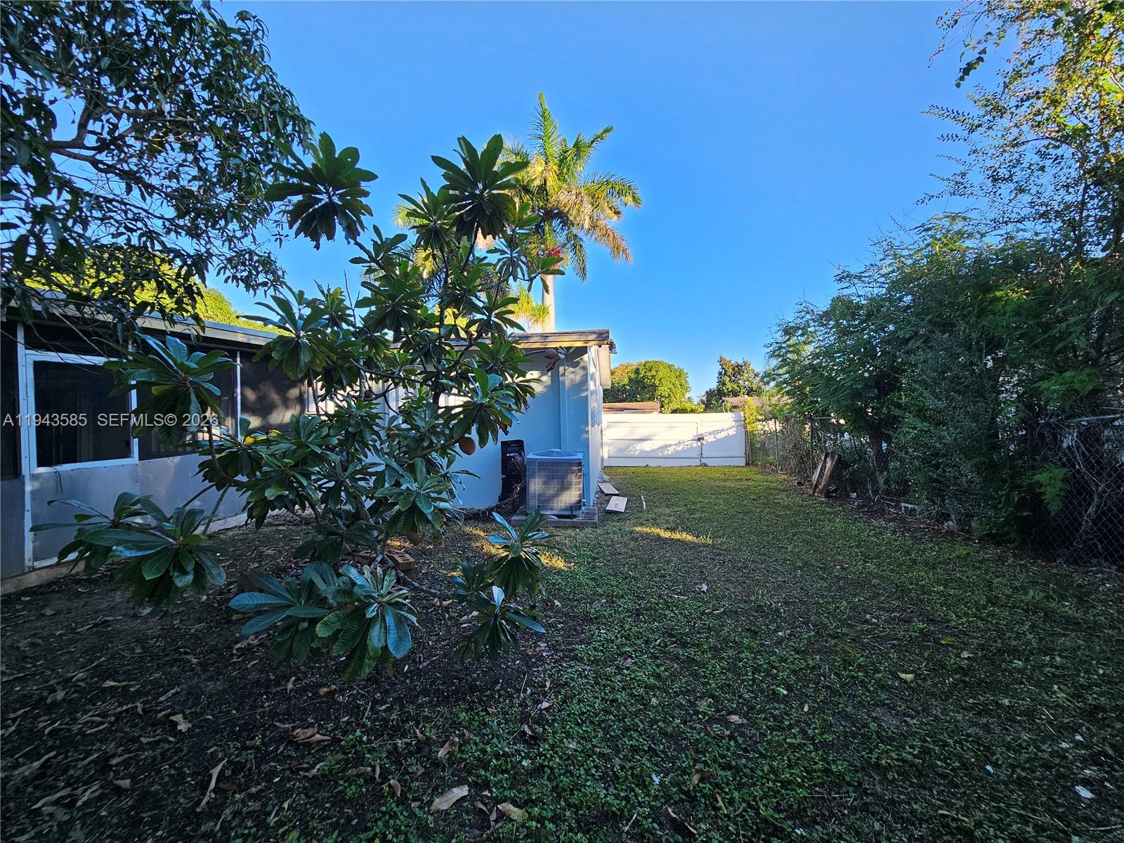 9940 Southwest 162nd Street Miami, FL 33157 - Photo 21 of 21 a view of a house with a garden