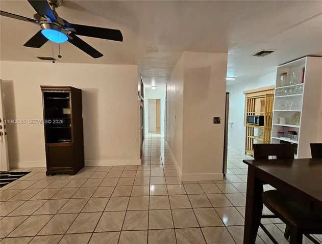 a view of a livingroom with furniture and chandelier