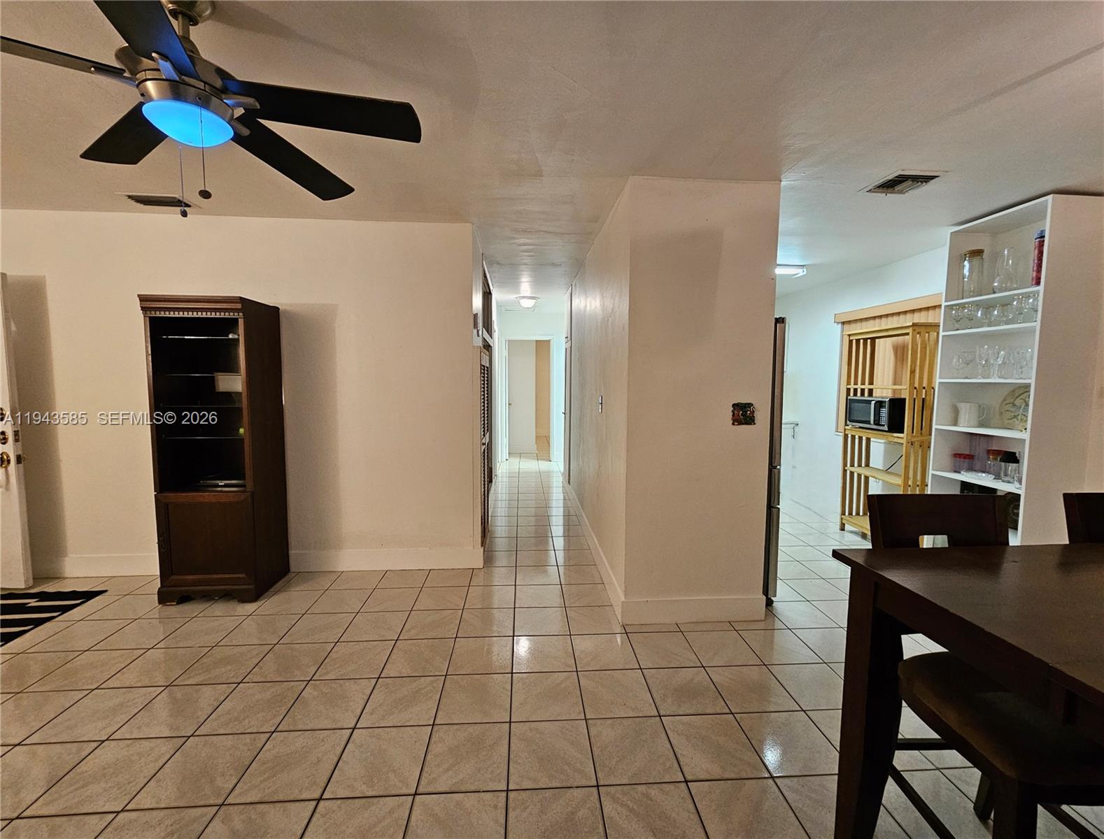 9940 Southwest 162nd Street Miami, FL 33157 - Photo 4 of 21 a view of a livingroom with furniture and chandelier