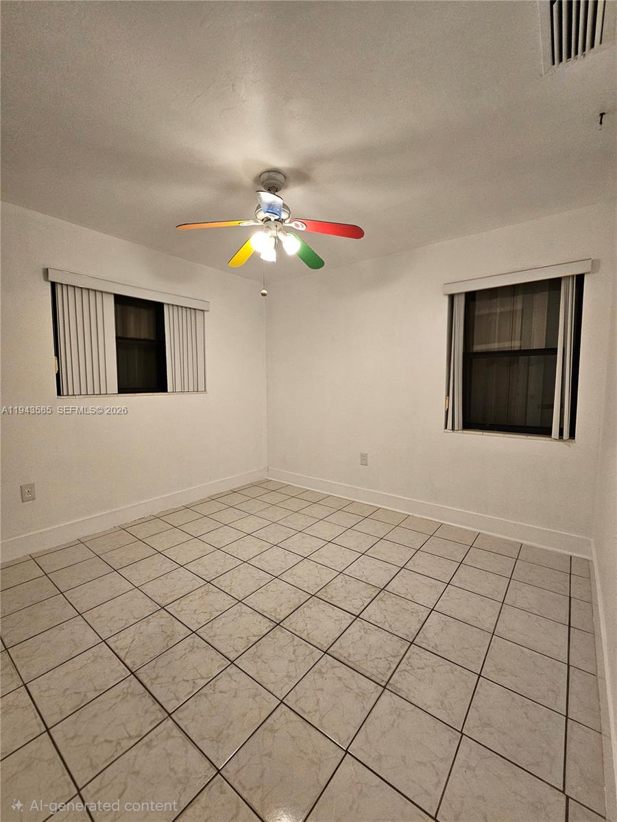 9940 Southwest 162nd Street Miami, FL 33157 - Photo 10 of 21 a view of an empty room and window