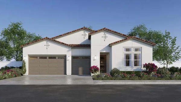 a view of a white house with a large windows next to a road
