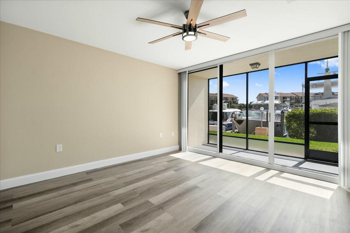 2601 Marina Isle Way, Unit 103 Jupiter, FL 33477 - Photo 20 of 56 a view of an empty room with windows