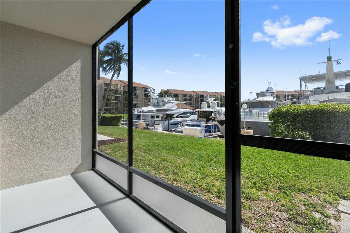 2601 Marina Isle Way, Unit 103 Jupiter, FL 33477 - Photo 22 of 56 a view of lake from a window