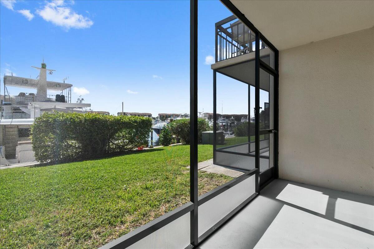 2601 Marina Isle Way, Unit 103 Jupiter, FL 33477 - Photo 23 of 56 a view of a balcony with yard