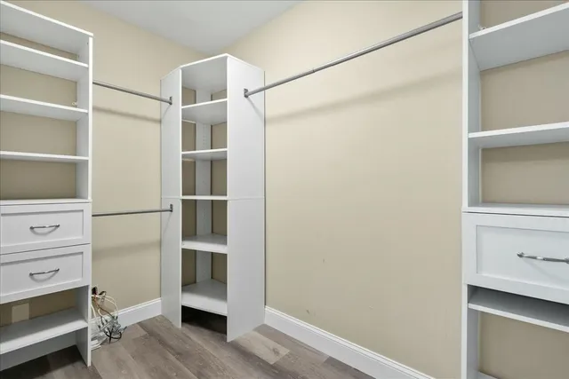 a bedroom with a bed and couch