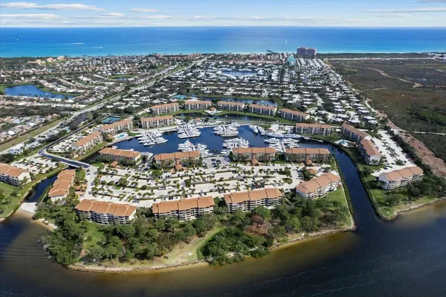 an aerial view of city and lake