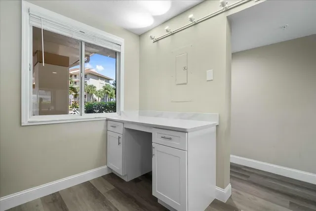 a view of kitchen with wooden floor and window