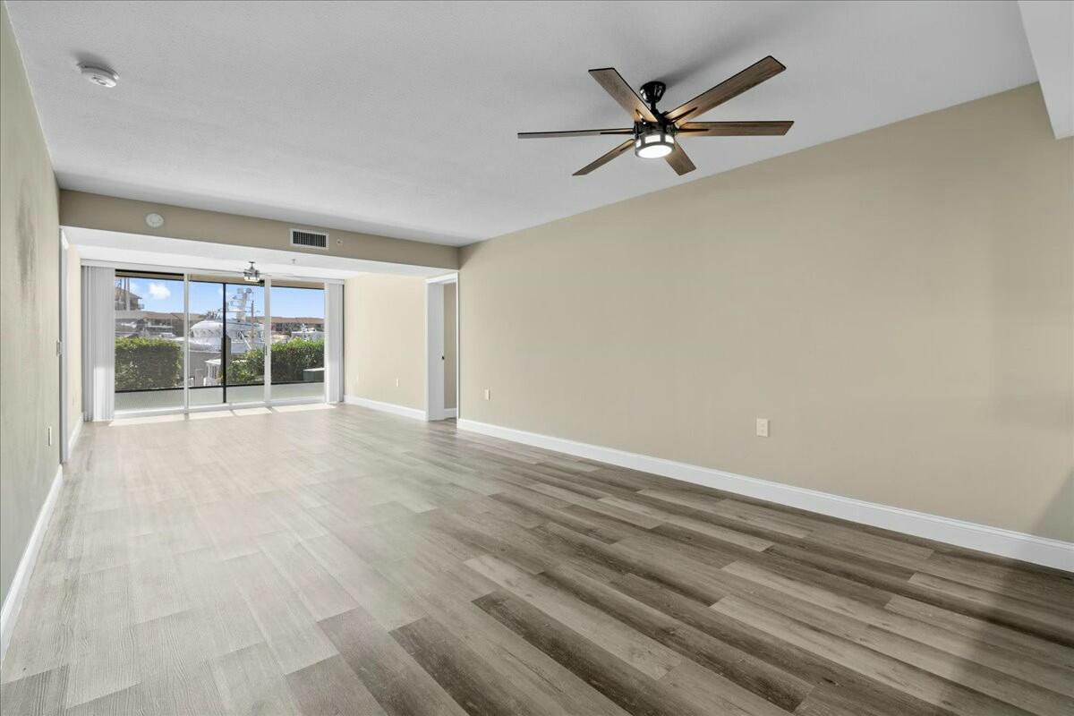 2601 Marina Isle Way, Unit 103 Jupiter, FL 33477 - Photo 6 of 56 a view of an empty room with a window