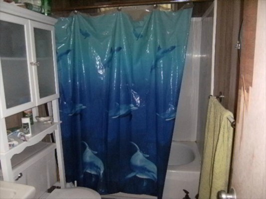 4586 Mamane Street Kapaa, HI 96746 - Photo 4 of 4 a bathroom with a shower and toilet