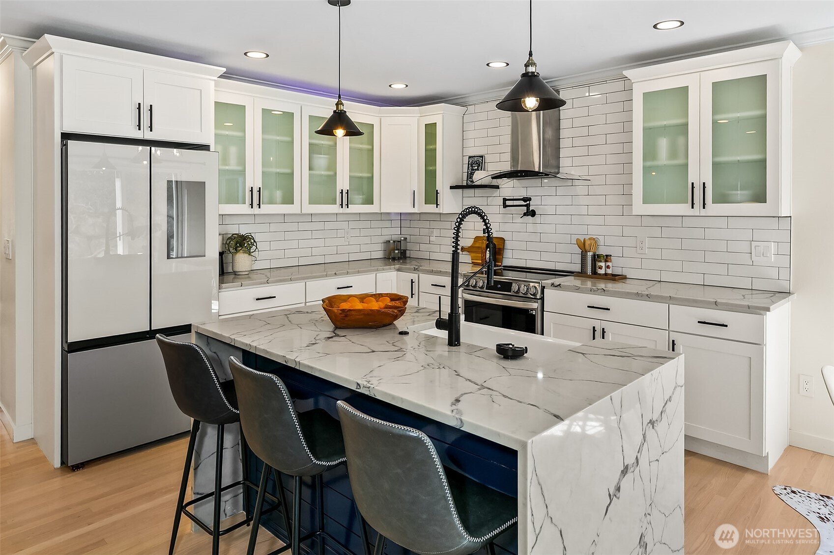 23115 15th Avenue Southeast, Unit D1 Bothell, WA 98021 - Photo 10 of 24 a kitchen with stainless steel appliances a sink a stove a refrigerator a center island and a cabinets
