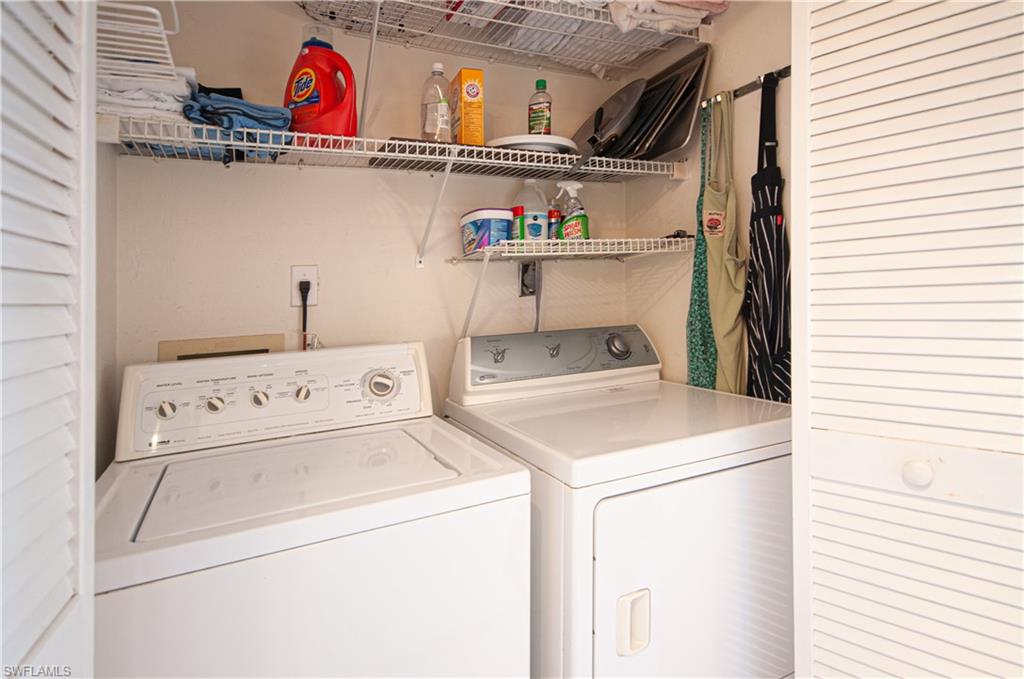 1208 Commonwealth Circle, Unit J103 Naples, FL 34116 - Photo 24 of 31 a utility room with dryer and washer
