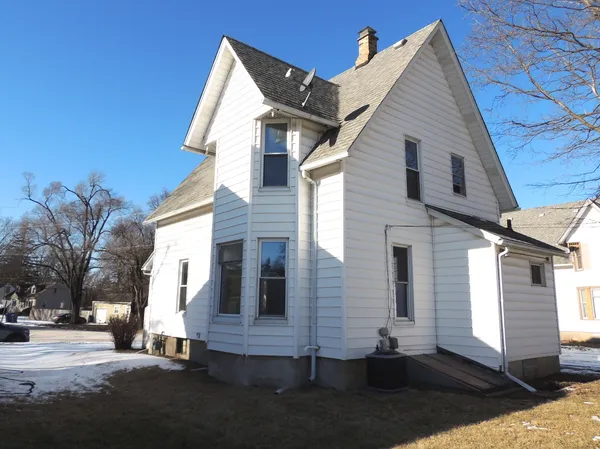 a view of a house with a street