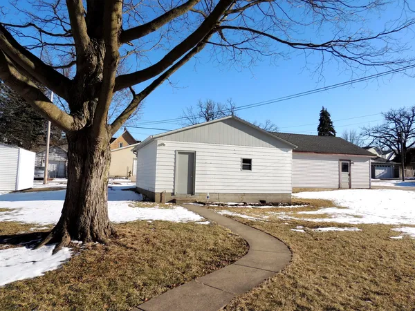 a view of a house with a snow in the yard