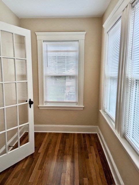 25 Glendower Road, Unit 2 Boston, MA 02131 - Photo 14 of 17 a view of a room with wooden floor and windows