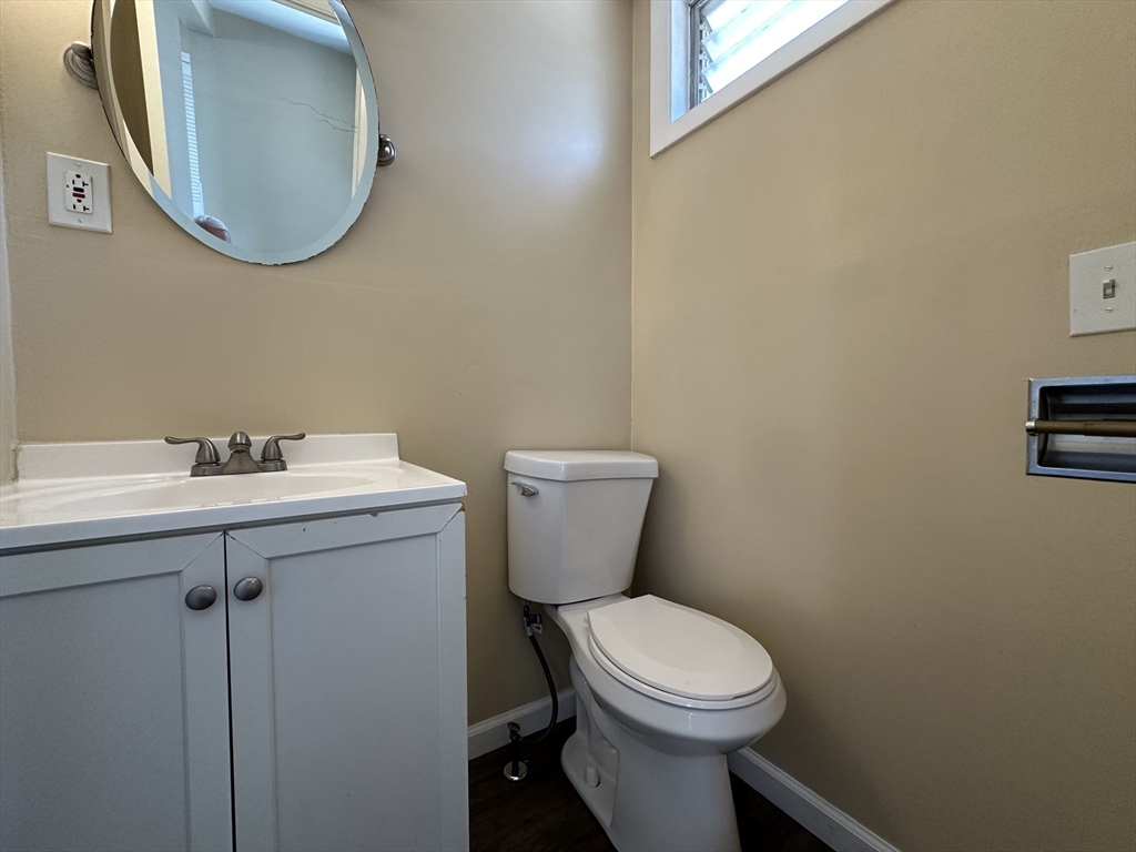 177 Johnson Street Springfield, MA 01108 - Photo 13 of 23 a bathroom with a toilet sink and mirror