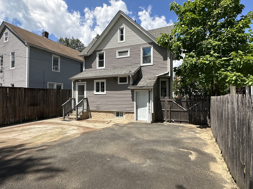 177 Johnson Street Springfield, MA 01108 - Photo 20 of 23 a front view of a house with a garage