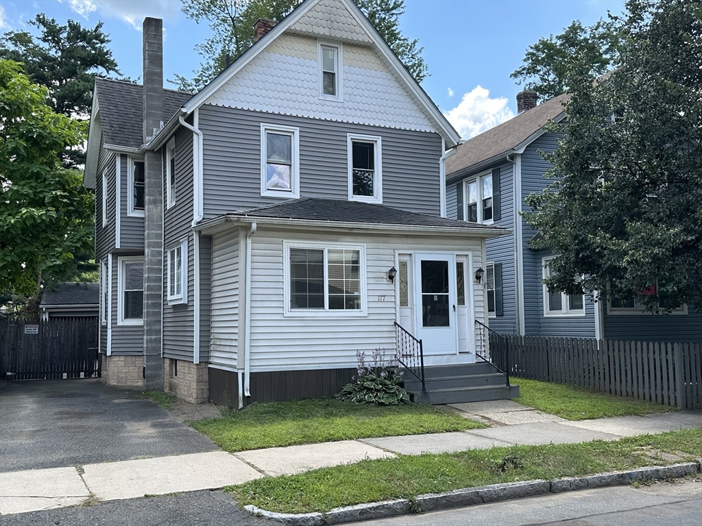 177 Johnson Street Springfield, MA 01108 - Photo 2 of 23 a front view of a house with a yard