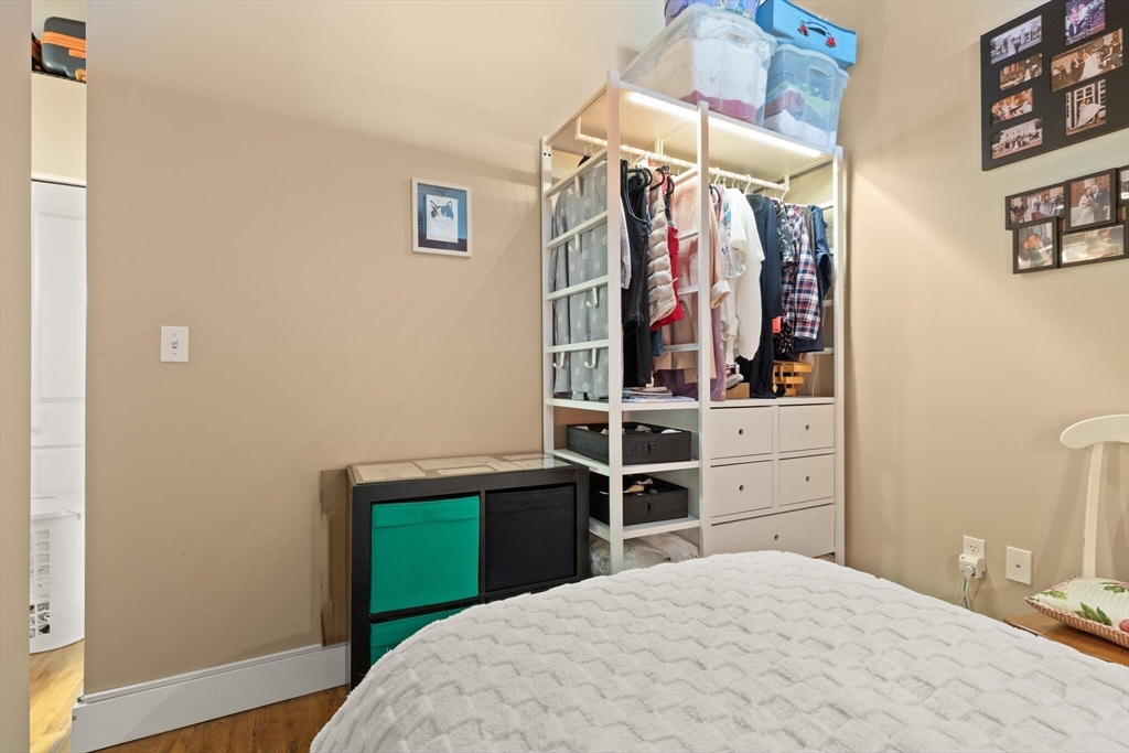 99 Allen Street, Unit 205 Woonsocket, RI 02895 - Photo 28 of 37 a bedroom with a bed and a closet