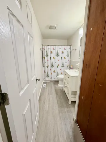 a view of a bathroom with bathtub and shower