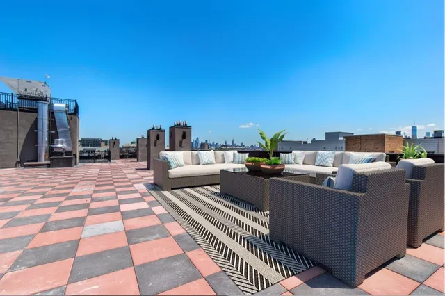 a view of a terrace with furniture