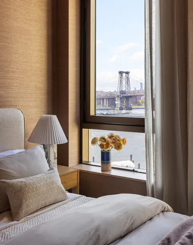 a bedroom with a bed and window