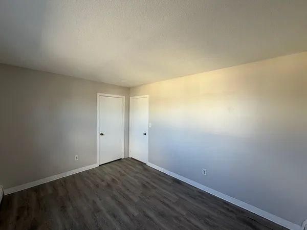 a view of room with wooden floor
