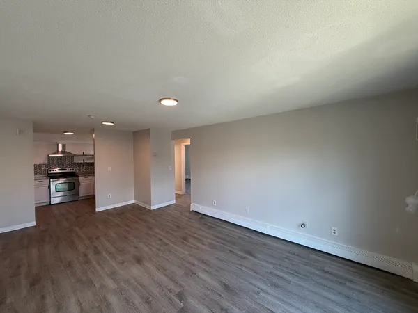 a view of a kitchen with a sink and a microwave