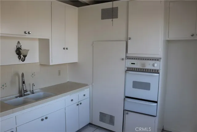 a kitchen with stainless steel appliances a cabinets and a stove