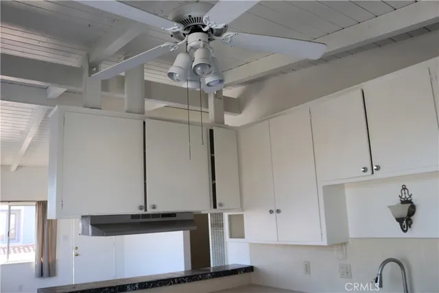 a kitchen with stainless steel appliances granite countertop a sink and cabinets