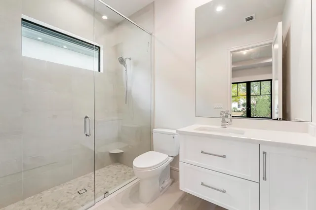 a utility room with sink dryer and washer