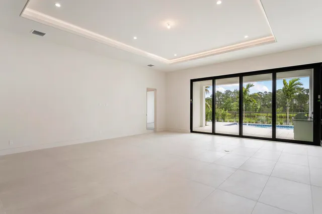 a view of an empty room with a sliding door