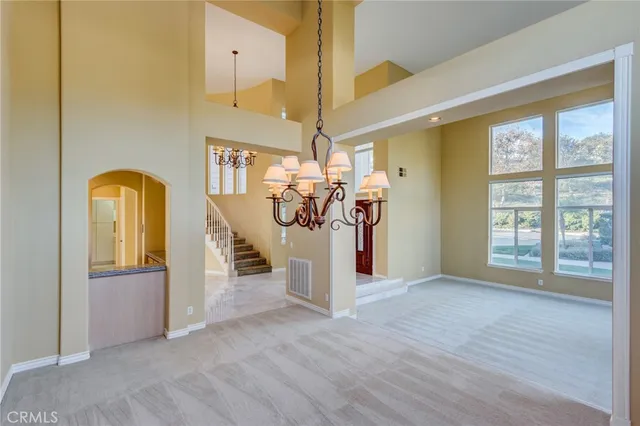 a kitchen with granite countertop cabinets stainless steel appliances and a counter space