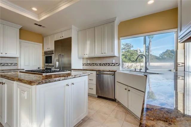 a view of staircase with railing and a rug