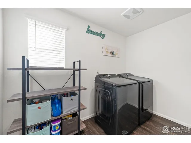 a view of storage and utility room with washer and dryer