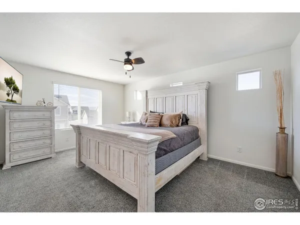 a large white bed in a white room